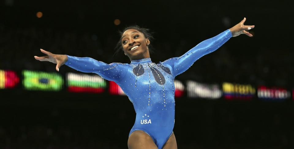 United States' Simone Biles celebrates winning the gold medal during the women's all-round final at the Artistic Gymnastics World Championships in Antwerp, Belgium, Friday, Oct. 6, 2023. (AP Photo/Geert vanden Wijngaert)