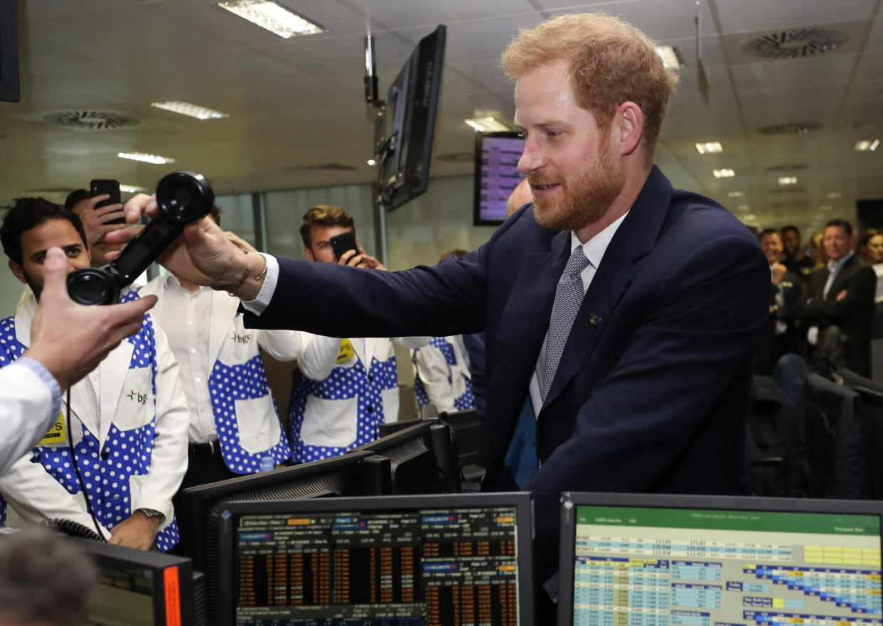 LONDON, UNITED KINGDOM - SEPTEMBER 11:  Prince Harry, Duke of Sussex s handed a phone as he attends the 15th annual BGC Charity Day, on September 11, 2019 in London, England. The annual day is to commemorate the 658 Cantor Fitzgerald and the 61 EuroBrokers employees who lost their lives in the 9/11 attacks. (Photo by Kirsty Wigglesworth - WPA Pool/Getty Images)