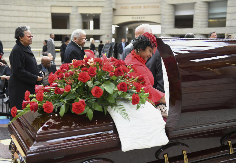 Monica Conyers, widow of the late U.S. Rep. John Conyers, pauses at her husband's casket during visitation services at the Charles H. Wright Museum of African American History in Detroit on Sunday, Nov. 3, 2019. Conyers died Sunday, Oct. 27, at age 90, two years after resigning from the U.S. House. (Robin Buckson/Detroit News via AP)