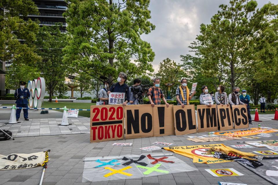 Protesters hold a 'No Olympics' banner during a protest against the Tokyo Olympics on May 9, 2021 in Tokyo.