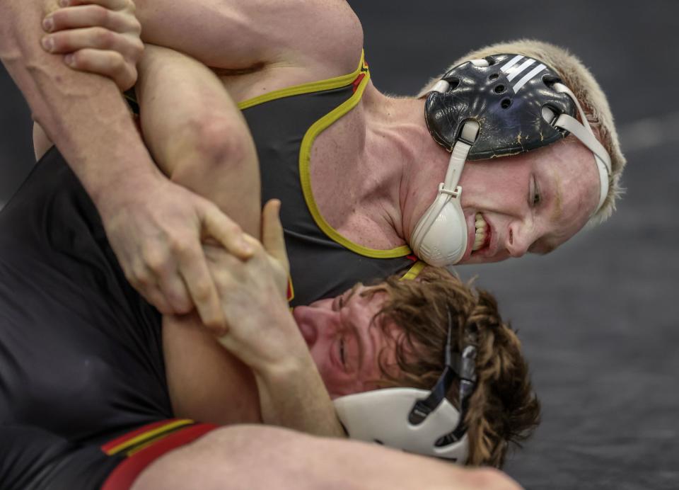 Mountain View’s Landon Shumway wrestles Mountain Crest’s Carter Egbert in the 4A Wrestling State Championships at the UCCU Center in Orem on Friday, Feb. 16, 2024. | Laura Seitz, Deseret News