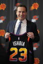 Mat Ishbia, new controlling interest owner of the Phoenix Suns and Phoenix Mercury, holds up a jersey as he is introduced to the media during an NBA basketball news conference, Wednesday, Feb. 8, 2023, in Phoenix. (AP Photo/Rick Scuteri)