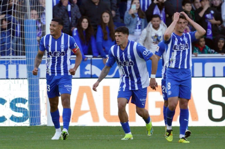 Alaves' Uruguayan midfielder <a class="link " href="https://sports.yahoo.com/soccer/players/3871773/" data-i13n="sec:content-canvas;subsec:anchor_text;elm:context_link" data-ylk="slk:Carlos Benavidez;sec:content-canvas;subsec:anchor_text;elm:context_link;itc:0">Carlos Benavidez</a> celebrates scoring the opening goal against Atletico (CESAR MANSO)