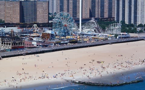 A view of the beach at Coney Island in the Eighties - Credit: Getty