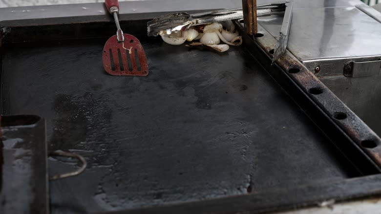 used griddle with utensils