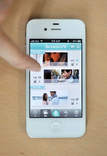 The smartphonee app "Between" is displayed on an iPhone. Couples unwilling to share their relationship with the world through Facebook or other social media have flocked to sign up for Between, an intimate app designed for two