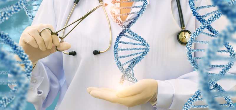 Woman in labcoat holding a double helix.