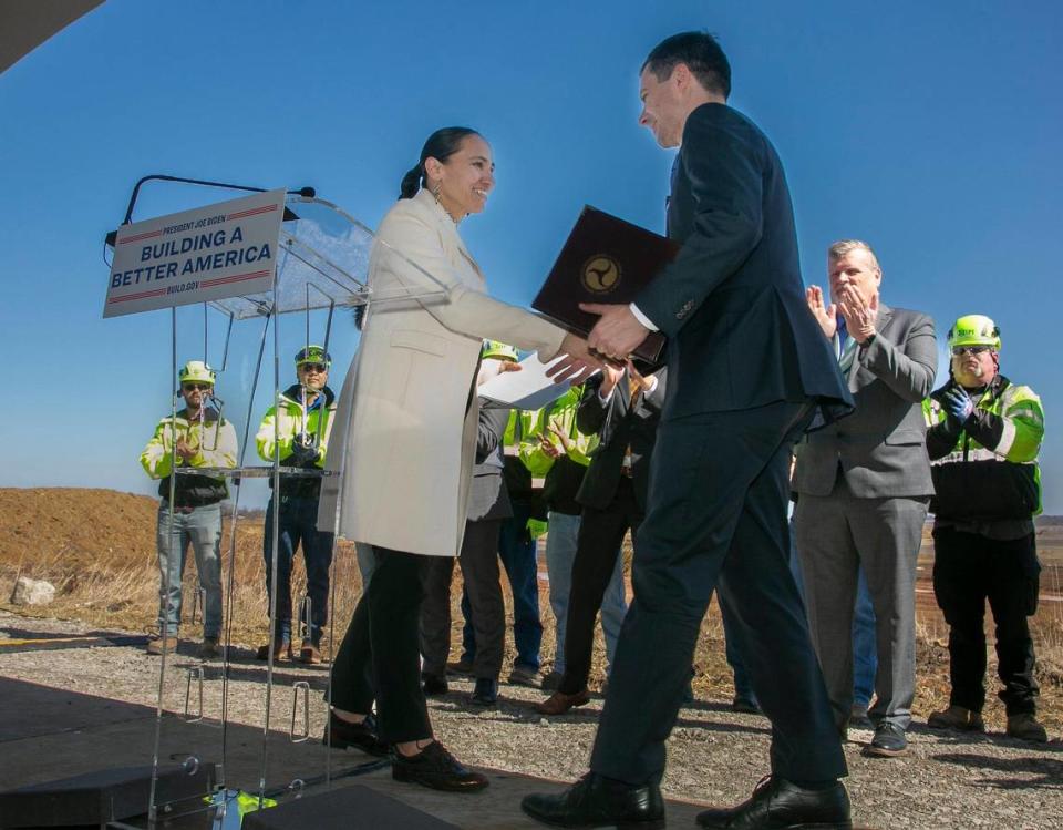 Transportation Secretary, Pete Buttigieg greeted Kansas representative Sharice Davids during a press conference and visit to the Panasonic site in De Soto, Kansas Monday, Feb. 27, 2023.