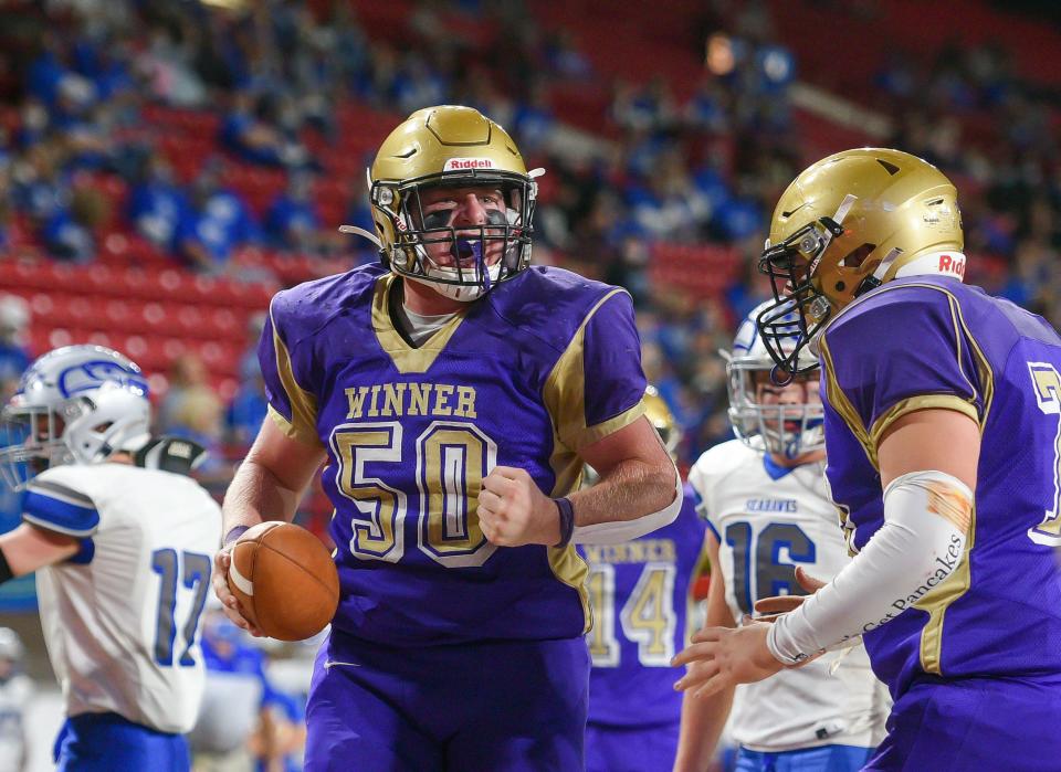 Winner's Preston Norrid yells in celebration after scoring a touchdown in the 11B state football championship on Friday, November 13, at the DakotaDome in Vermillion.