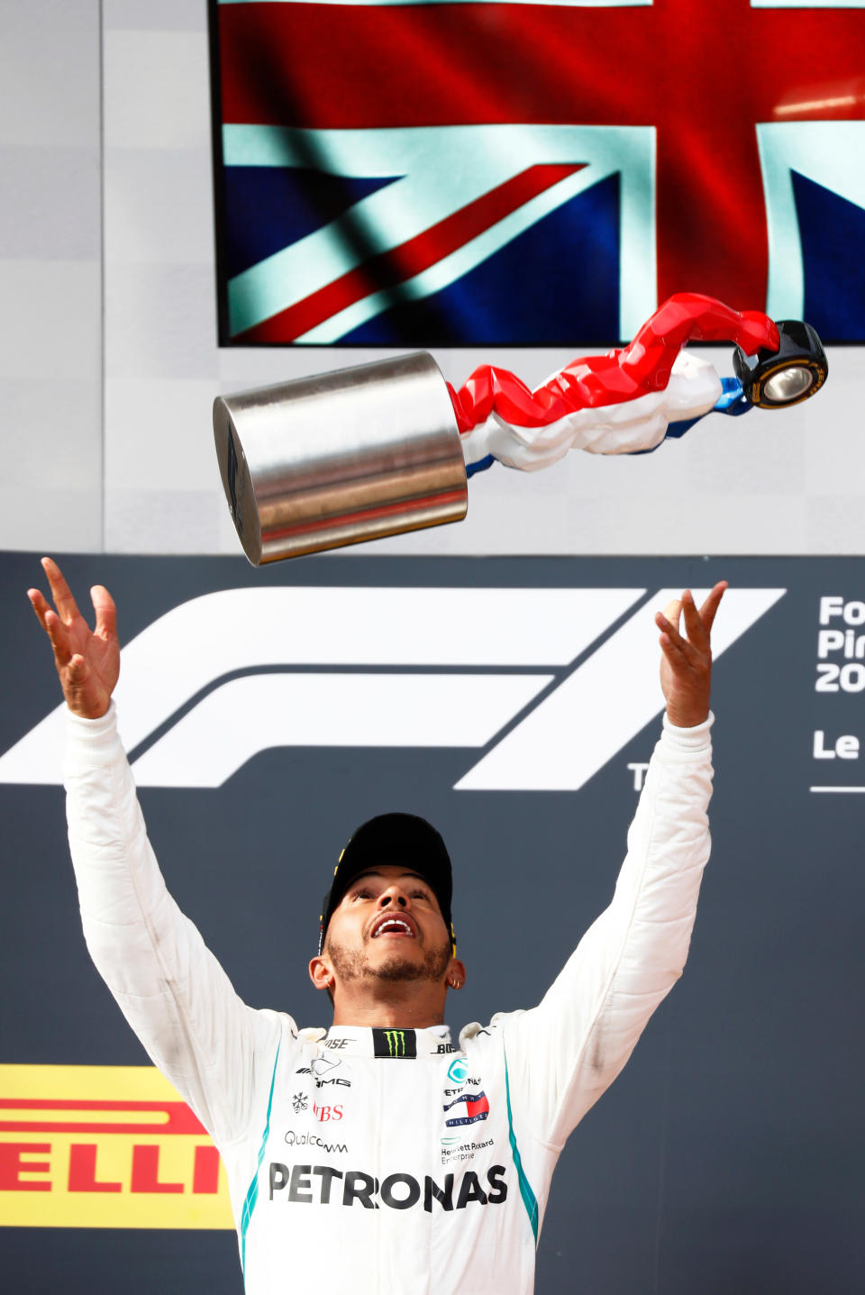 The King and I: Lewis Hamilton launches his ‘King Kong’ trophy into the air after his French Grand Prix victory