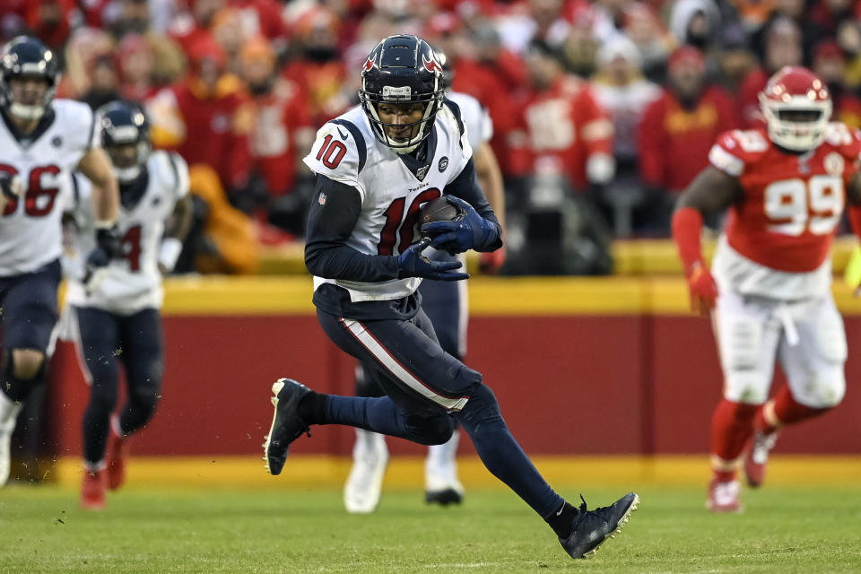 FILE - In this Jan. 12, 2020, file photo, Houston Texans wide receiver DeAndre Hopkins (10) runs against the Kansas City Chiefs during the second half of an NFL football game in Kansas City, Mo. The Arizona Cardinals have acquired three-time All-Pro receiver DeAndre Hopkins in a trade that will send running back David Johnson and draft picks to the Houston Texans, a person familiar with the situation told The Associated Press. The person spoke to the AP on condition of anonymity Monday, March 16, 2020, because the trade hasn't been officially announced. (AP Photo/Reed Hoffmann, File)