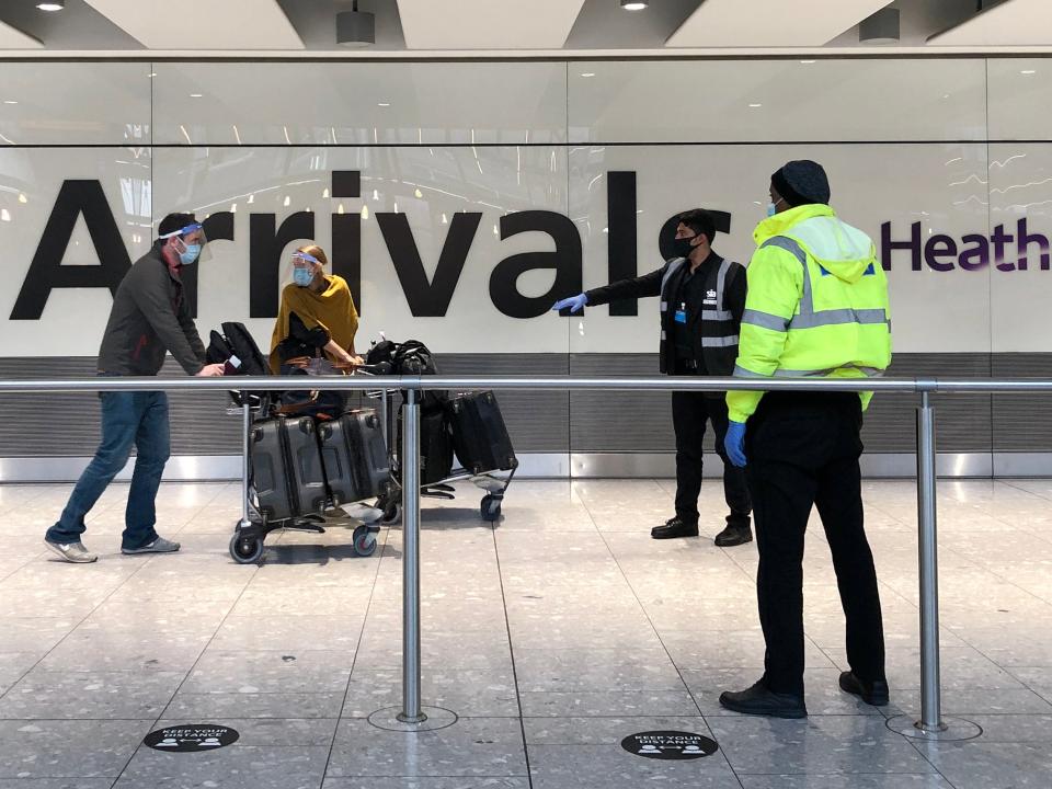 <p>Passengers arriving at Heathrow are directed towards coaches bound for quarantine hotels </p> (Getty Images)