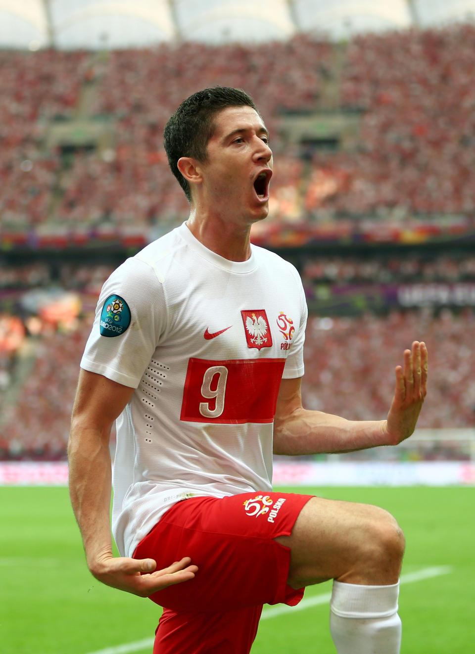 WARSAW, POLAND - JUNE 08: Robert Lewandowski of Poland celebrates scoring the opening goal during the UEFA EURO 2012 Group A match between Poland and Greece at National Stadium on June 8, 2012 in Warsaw, Poland. (Photo by Michael Steele/Getty Images)