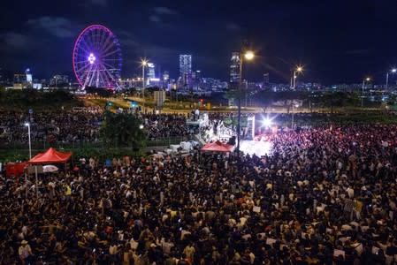 Demonstrators attend a rally ahead of the G20 summit, urging the international community to back their demands for the government to withdraw a the extradition bill in Hong Kong