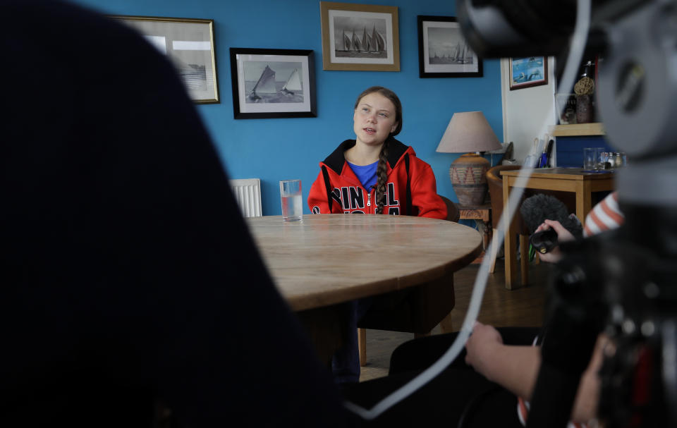 Greta Thunberg is interviewed by The Associated Press in Plymouth, England Tuesday, Aug. 13, 2019. Greta Thunberg, the 16-year-old climate change activist who has inspired student protests around the world, is heading to the United States this week - in a sailboat. (AP Photo/Kirsty Wigglesworth)