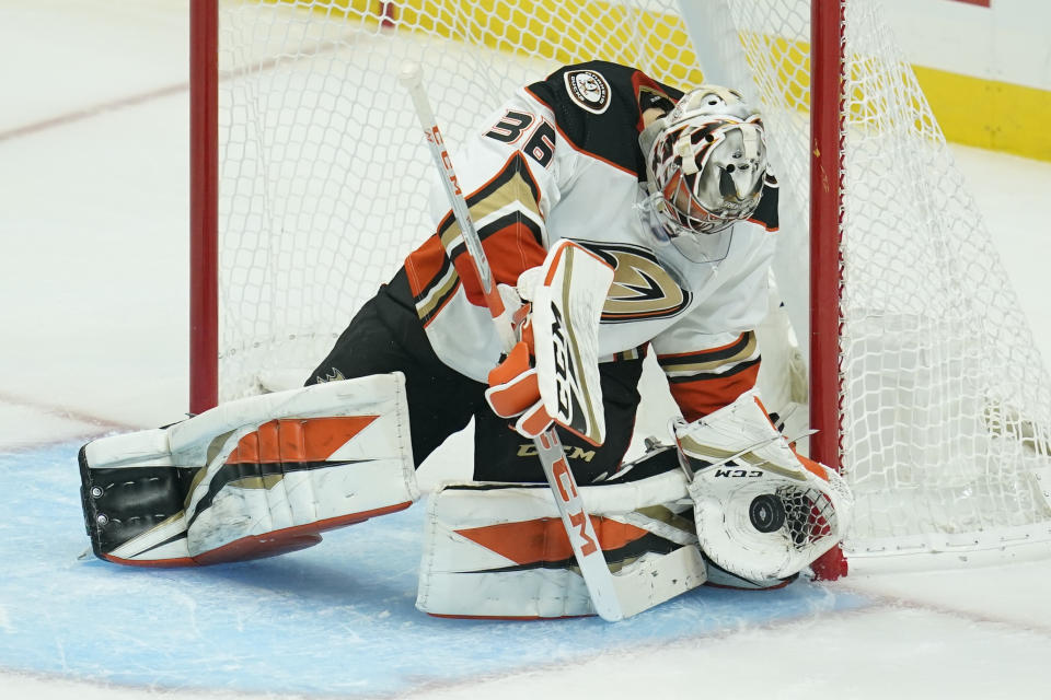 Anaheim Ducks goaltender John Gibson (36) makes a save during the second period of an NHL hockey game against the Los Angeles Kings Tuesday, Feb. 2, 2021, in Los Angeles. (AP Photo/Ashley Landis)