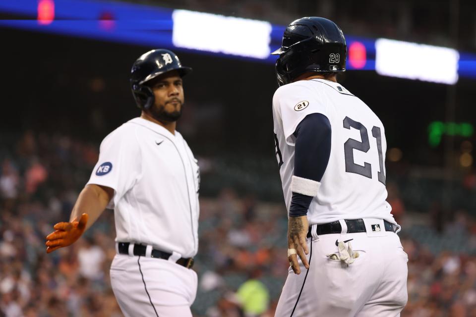 Javier Baez, right, of the Detroit Tigers celebrates scoring a run in the first inning with Jeimer Candelario while playing the Chicago White Sox at Comerica Park in Detroit on Friday, Sept. 16, 2022.