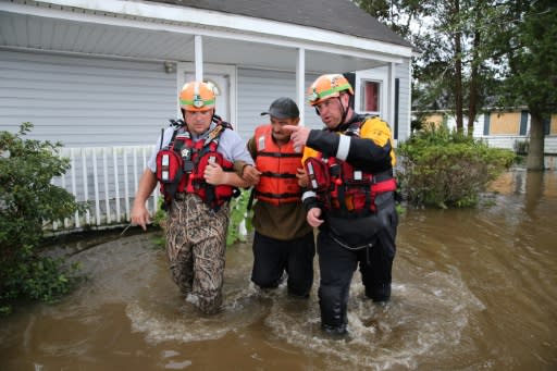 The effects of climate change, such as the flooding seen in North Carolina during Hurricane Florence in September 2018, will get worse unless more drastic action is taken to cut carbon emissions, a major US government report warned