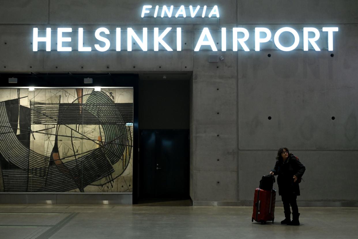 A woman stands at Helsinki Airport in Helsinki, Finland, on October 28, 2022.