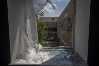 Damages seen in the sleeping room of a kindergarten in the aftermath of Russian missile strikes fired toward Kyiv early Sunday, where a crater pocked the courtyard, in Kyiv, Ukraine, Monday, June 27, 2022. (AP Photo/Nariman El-Mofty)