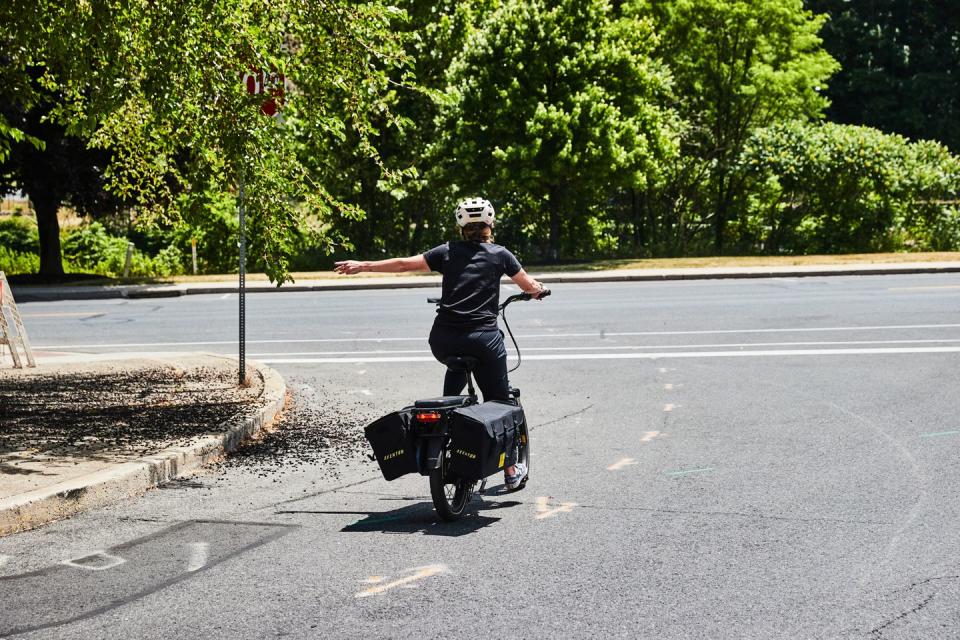 signaling at a stop sign on an ebike