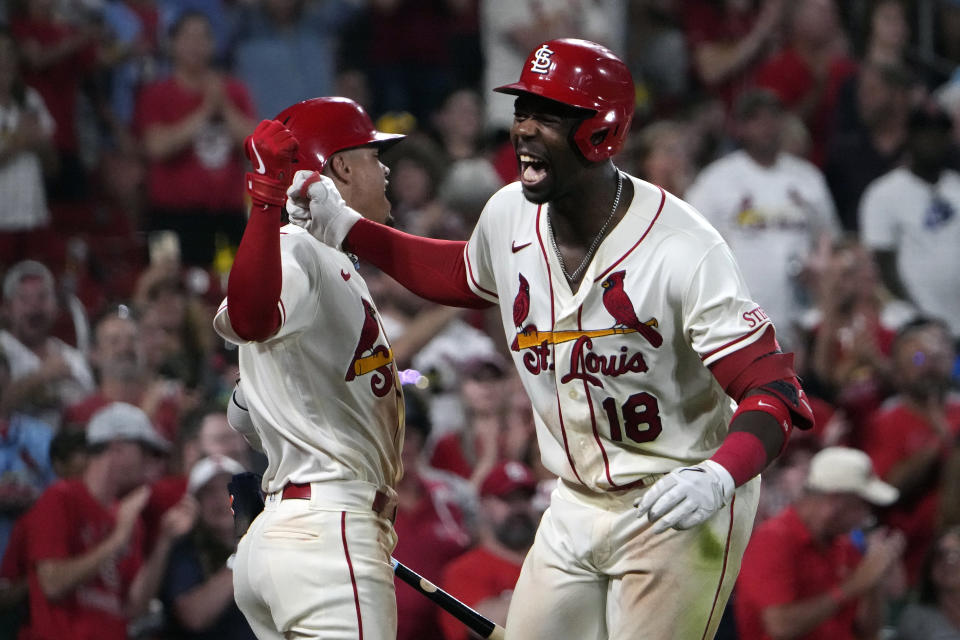 St. Louis Cardinals' Jordan Walker (18) is congratulated by teammate Masyn Winn after hitting a two-run home run during the seventh inning of a baseball game against the Pittsburgh Pirates Saturday, Sept. 2, 2023, in St. Louis. (AP Photo/Jeff Roberson)