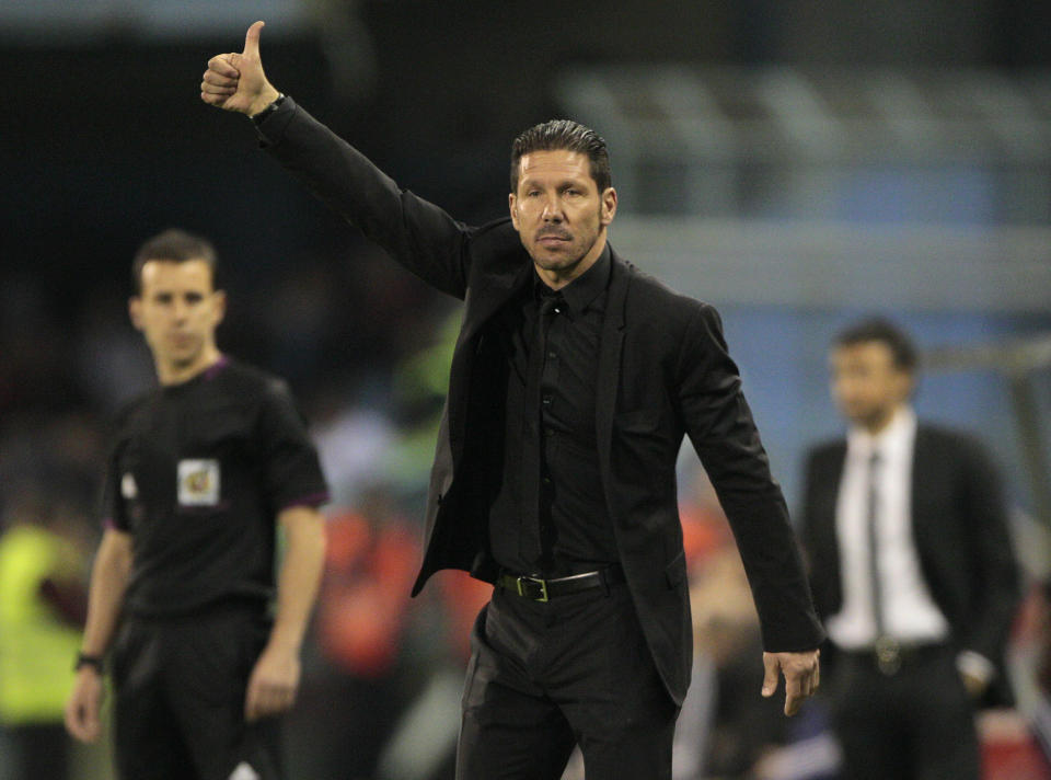 Atletico's coach Diego Pablo Simeone from Argentina gestures during a Spanish La Liga soccer agains Real Club Celta at the Balaidos stadium in Vigo, Spain, Saturday, March 8, 2014. (AP Photo/Lalo R. Villar)