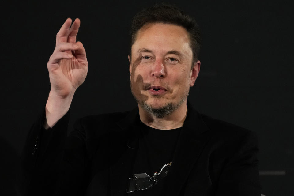 Tesla and SpaceX's CEO Elon Musk gestures during an in-conversation event with Britain's Prime Minister Rishi Sunak in London, Thursday, Nov. 2, 2023. Sunak discussed AI with Elon Musk in a conversation that is played on the social network X, which Musk owns.(AP Photo/Kirsty Wigglesworth, Pool)