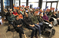 In this photo taken Monday, April 15, 2019, residents voice their opposition to a proposed homeless shelter in their waterfront neighborhood of San Francisco. The renowned waterfront hosts joggers, admiring tourists and towering condos with impressive views. It could also become the site of a new homeless shelter for up to 200 people. (AP Photo/Janie Har)