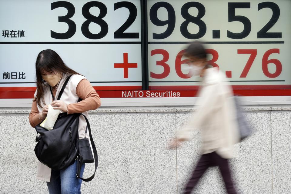 A person stands in front of an electronic stock board showing Japan's Nikkei 225 index at a securities firm Tuesday, April 30, 2024, in Tokyo. Asian shares mostly rose Tuesday, as investors kept their eyes on potentially market-moving reports expected later this week. (AP Photo/Eugene Hoshiko)