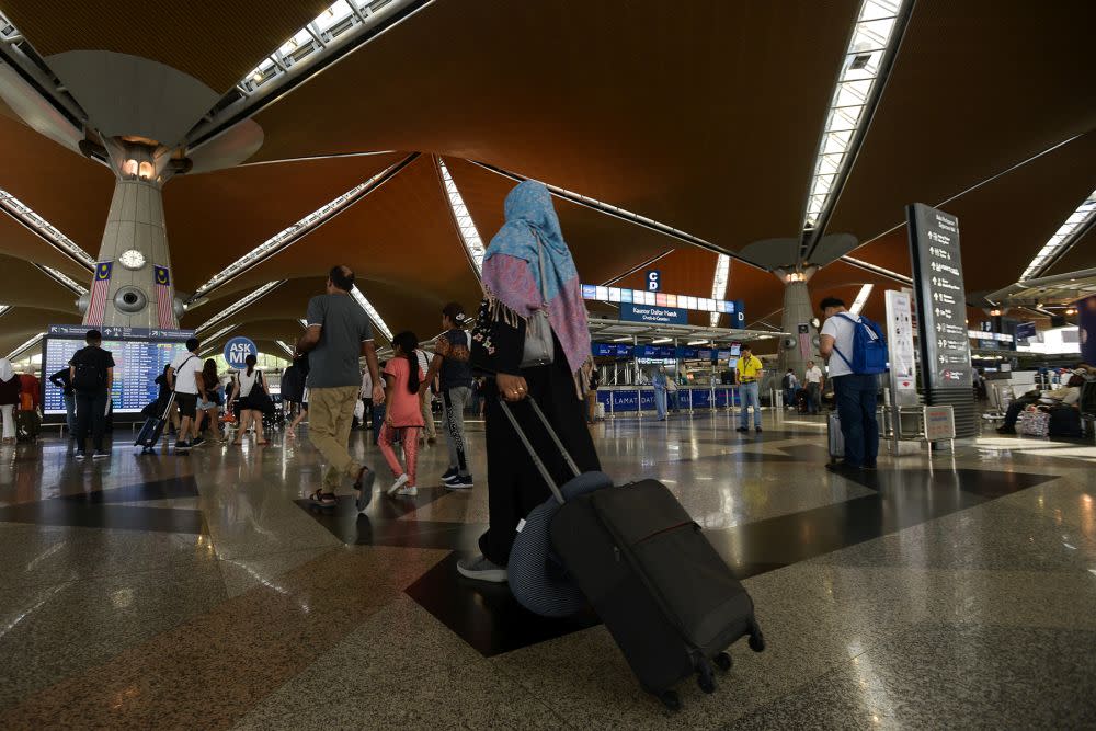 Travellers have been advised to be at their respective terminals at least four hours ahead of departure to avoid missing their flights. — Picture by Miera Zulyana