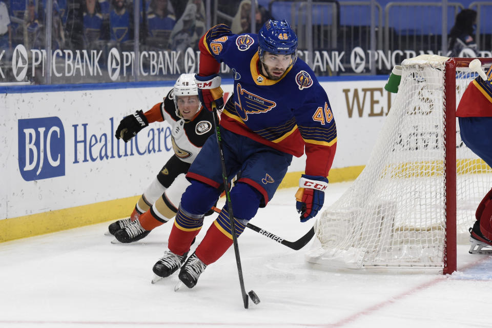 Anaheim Ducks' Isac Lundestrom (48) pressures St. Louis Blues' Jake Walman (46) during the first period of an NHL hockey game on Wednesday, May 5, 2021, in St. Louis. (AP Photo/Joe Puetz)