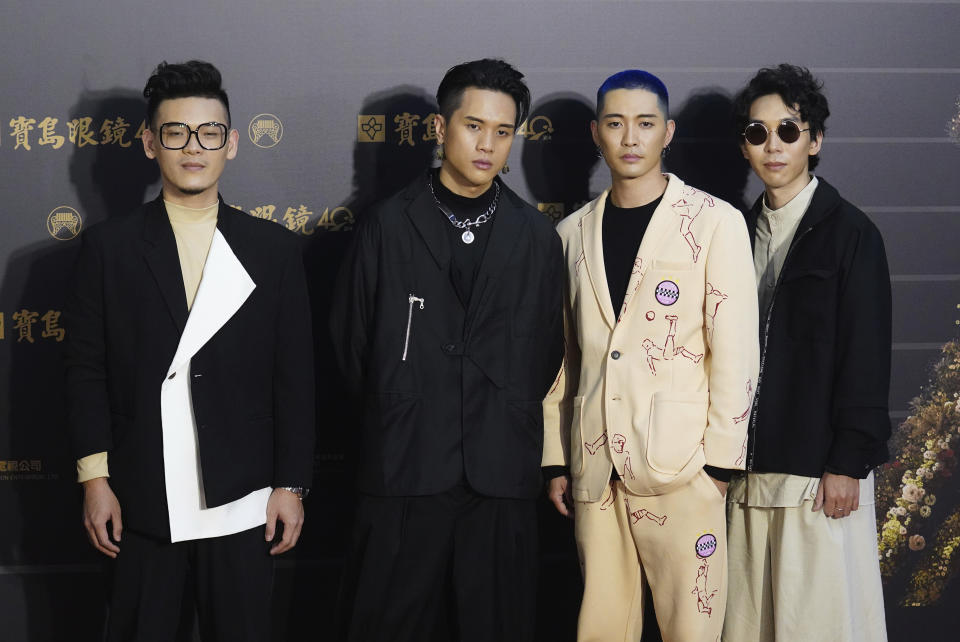 Taiwanese pop group Sugarcat pose as they arrive for the 31th Golden Melody Awards in Taipei, Taiwan, Saturday, Oct. 3, 2020. The awards show, one of the world's biggest Chinese-language pop music annual events was postponed from June to Oct. due to the coronavirus pandemic. (AP Photo/Billy Dai)