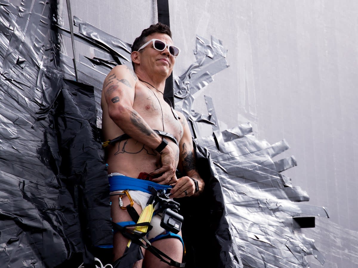 Steve-O pictured duct-taping himself to a billboard in 2020 as a promotional stunt (Getty Images)