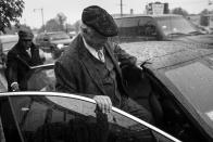 <p>Spencer Leak Sr climbs into his car ahead of a busy morning of funeral visitations. He tries to make an appearance at every memorial he and his staff plan. (Photo: Jon Lowenstein/NOOR for Yahoo News) </p>