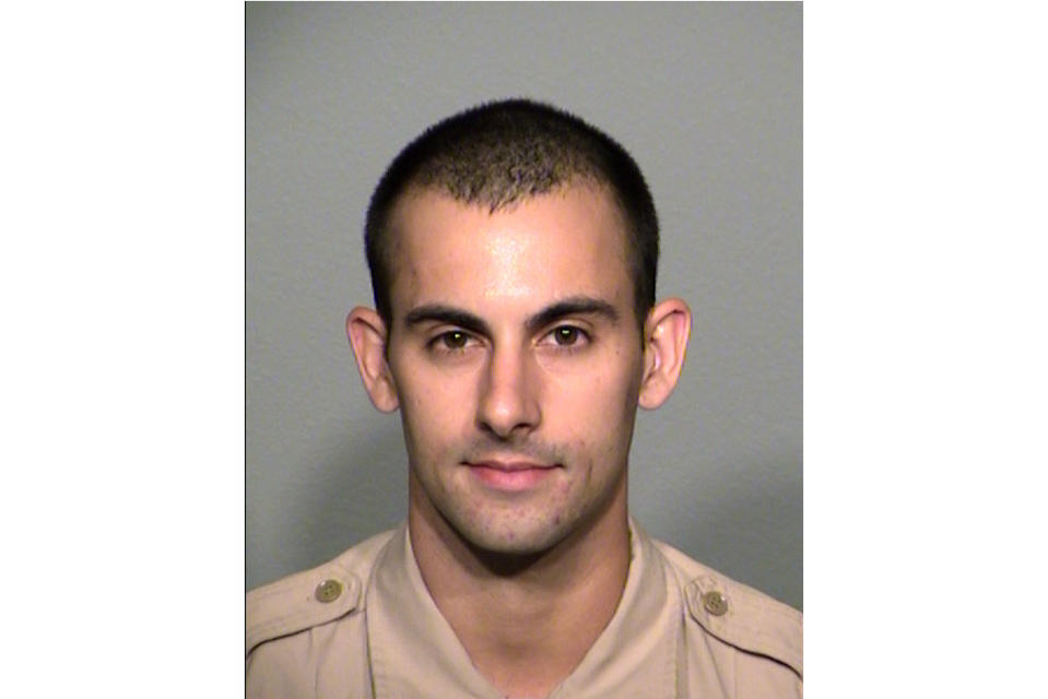 A photo provided by the Las Vegas Metropolitan Police Department shows officer Shay Kellin Mikalonis. Edgar Samaniego, accused of shooting and critically wounding Mikalonis, is to remain jailed pending arraignment Friday, June 5, 2020, on attempted murder and weapon charges, the man's public defense lawyer said. Mikalonis, 29, underwent surgery for spine and head injuries after being hit in the back of the neck June 1 by a gunshot that officials say was fired from across Las Vegas Boulevard during a nighttime protest over the May 25 death of a black man in police custody in Minneapolis. (Las Vegas Metropolitan Police Department via AP)