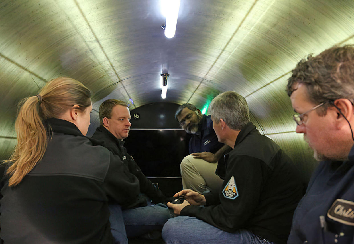 NOTE: THIS IS A GENERIC PICTURE OF THE INSIDE OF THE MISSING OceanGate Expeditions SUBMERSIBLE VESSEL  NAMED TITAN -- THE PEOPLE SEEN IN THE PICTURE ARE NOT THOSE CURRENTLY MISSING 

Undated handout photo issued by American Photo Archive of a generic picture showing the inside of the OceanGate Expeditions submersible vessel named Titan used to visit the wreckage site of the Titanic. Rescue teams are continuing the search for the submersible tourist vessel which went missing during a voyage to the Titanic shipwreck with British billionaire Hamish Harding among the five people aboard. Issue date: Tuesday June 20, 2023. PA Photo. The five-person OceanGate Expeditions vessel reported overdue on Sunday evening about 435 miles south of St John's, Newfoundland. See PA story SEA Titanic. Photo credit should read: American Photo Archive/Alamy/PA Wire 

NOTE TO EDITORS: This handout photo may only be used for editorial reporting purposes for the contemporaneous illustration of events, things or the people in the image or facts mentioned in the caption. Reuse of the picture may require further permission from the copyright holder. 