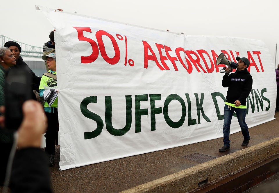 In December, community groups held a rally to demand more affordable housing in the Suffolk Downs redevelopment.&nbsp; (Photo: Boston Globe via Getty Images)