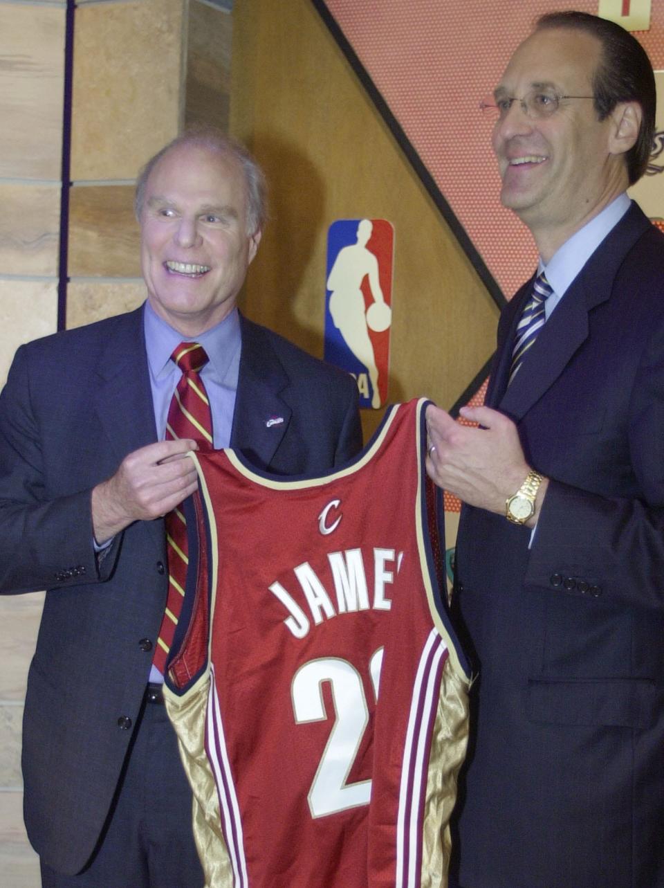 Gordon Gund, left, then owner of the Cavaliers, holds a Cavaliers jersey featuring LeBron James' name with Russ Granik, then NBA deputy commissioner, after Cleveland won the No.1 draft pick in the NBA Draft Lottery on May 22, 2003, in Secaucus, N.J.