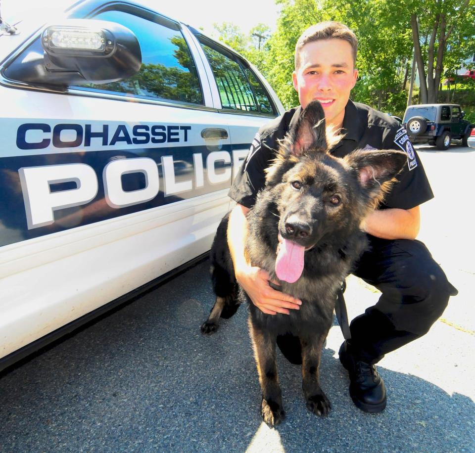 Cohasset’s first police dog, Erik, poses with his handler, police officer Patrick Reardon.