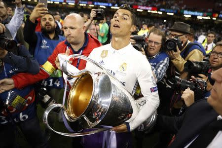 Britain Soccer Football - Juventus v Real Madrid - UEFA Champions League Final - The National Stadium of Wales, Cardiff - June 3, 2017 Real Madrid's Cristiano Ronaldo celebrates with the trophy after winning the UEFA Champions League Final Reuters / Carl Recine Livepic