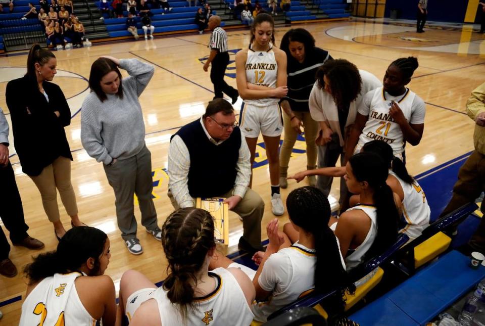 Franklin County coach Joey Thacker instructs his team during a fourth-quarter timeout in the Flyers’ 66-46 win over Ryle in Frankfort on Thursday.