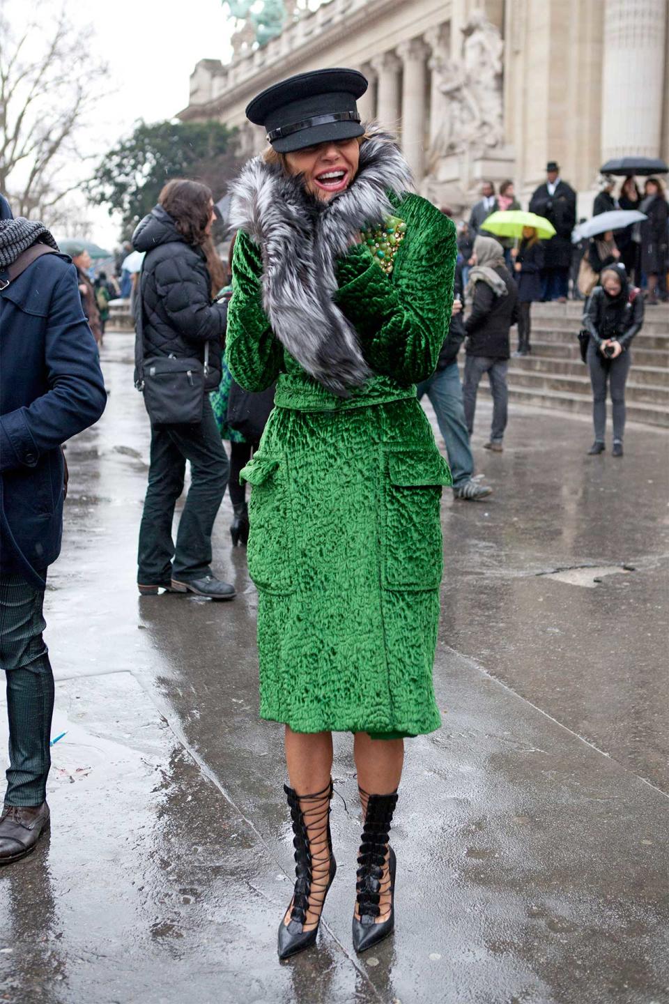 <p>A sharp captain hat and fuzzy stole are blizzard-chic additions to her cozy emerald coat.</p> <h4>Getty Images</h4>