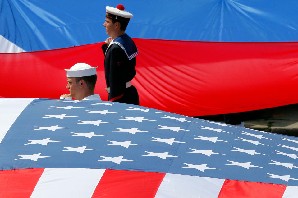 <p>French and U.S. soldiers display their national flags at the end the traditional Bastille Day military parade on the Champs Elysees in Paris, France, Friday, July 14, 2017. (Photo: Michel Euler/AP) </p>