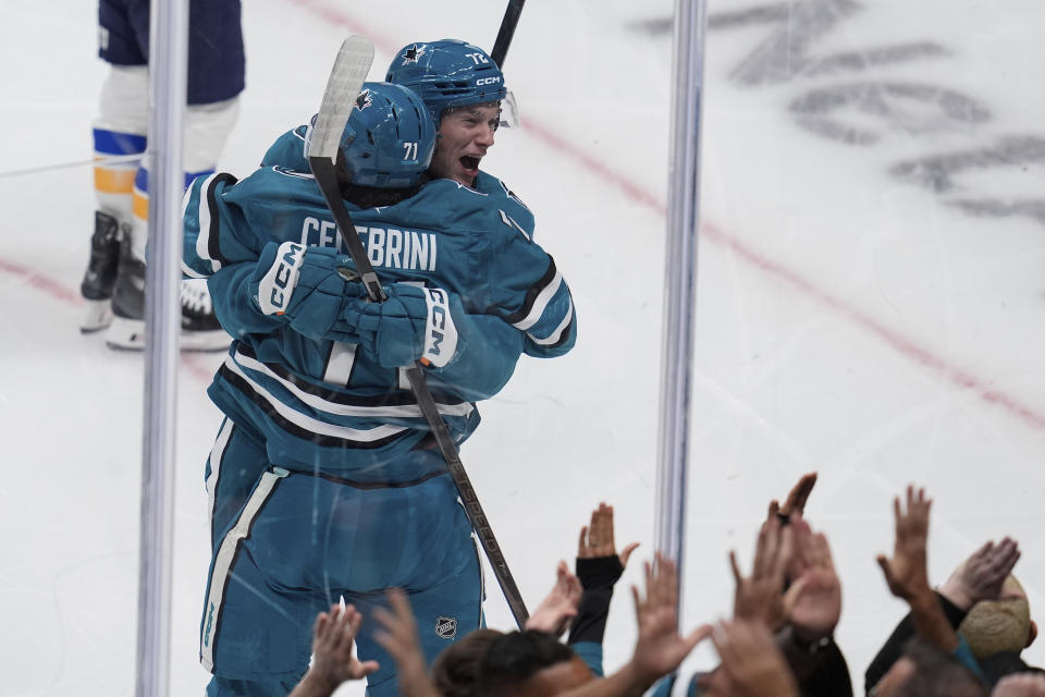 San Jose Sharks center Macklin Celebrini (71) is congratulated by left wing William Eklund (72) following his goal against the St. Louis Blues during the first period of an NHL hockey game Thursday, Oct. 10, 2024, in San Jose, Calif. (AP Photo/Godofredo A. Vásquez)