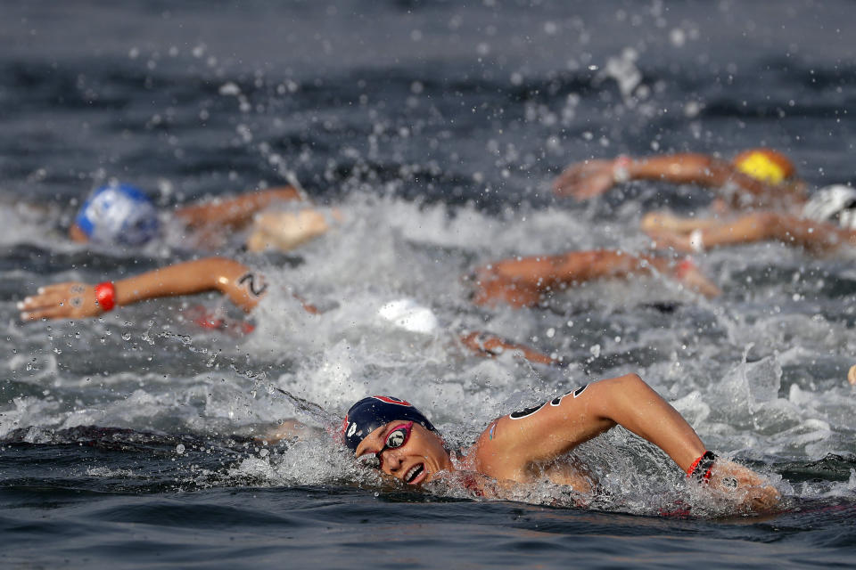 Haley Anderson of the United States competes in the women's 10km open water swim at the World Swimming Championships in Yeosu, South Korea, Sunday, July 14, 2019. (AP Photo/Mark Schiefelbein)