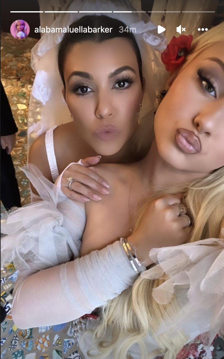 Alabama Barker poses with Kourtney Kardashian on her wedding day