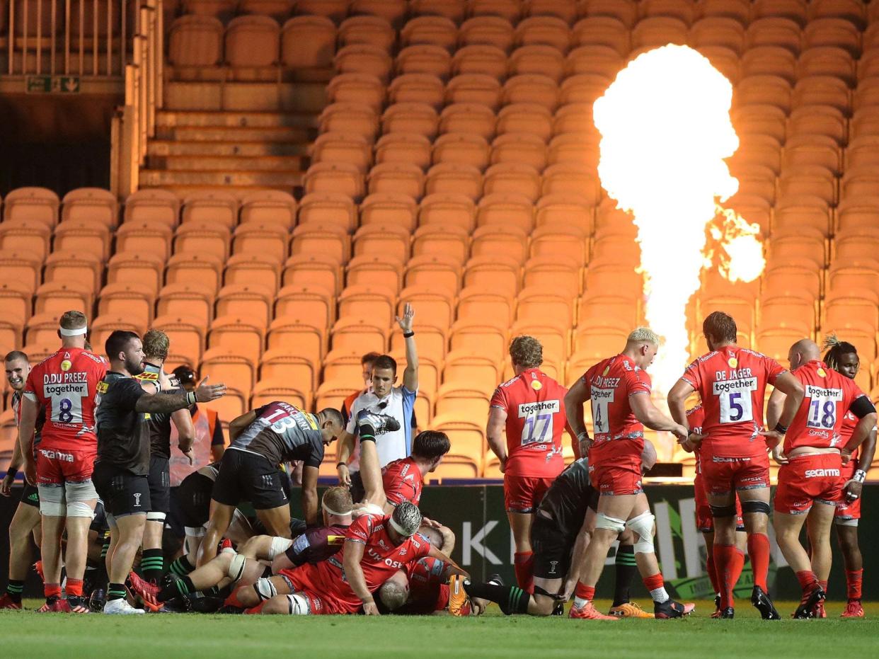 Scott Baldwin crashes over to score Harlequins' try against Sale Sharks: Getty