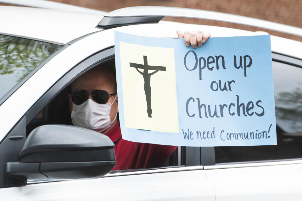 Demonstrators in Annapolis, Md., demand restrictions on church gatherings be lifted in April. (Tom Williams/CQ Roll Call via Getty Images)