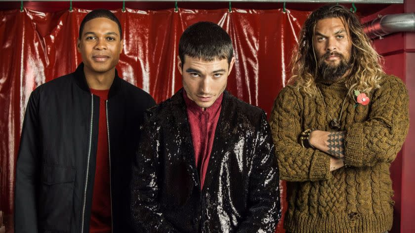 LONDON, ENGLAND: (L-R) Ray Fisher(Cyborg), Ezra Miller(The Flash), and Jason Momoa(Aquaman) pose for pictures in the Star Labs set at the press day event for the upcoming film "Justice League." CREDIT: Matthew Lloyd / For The Times